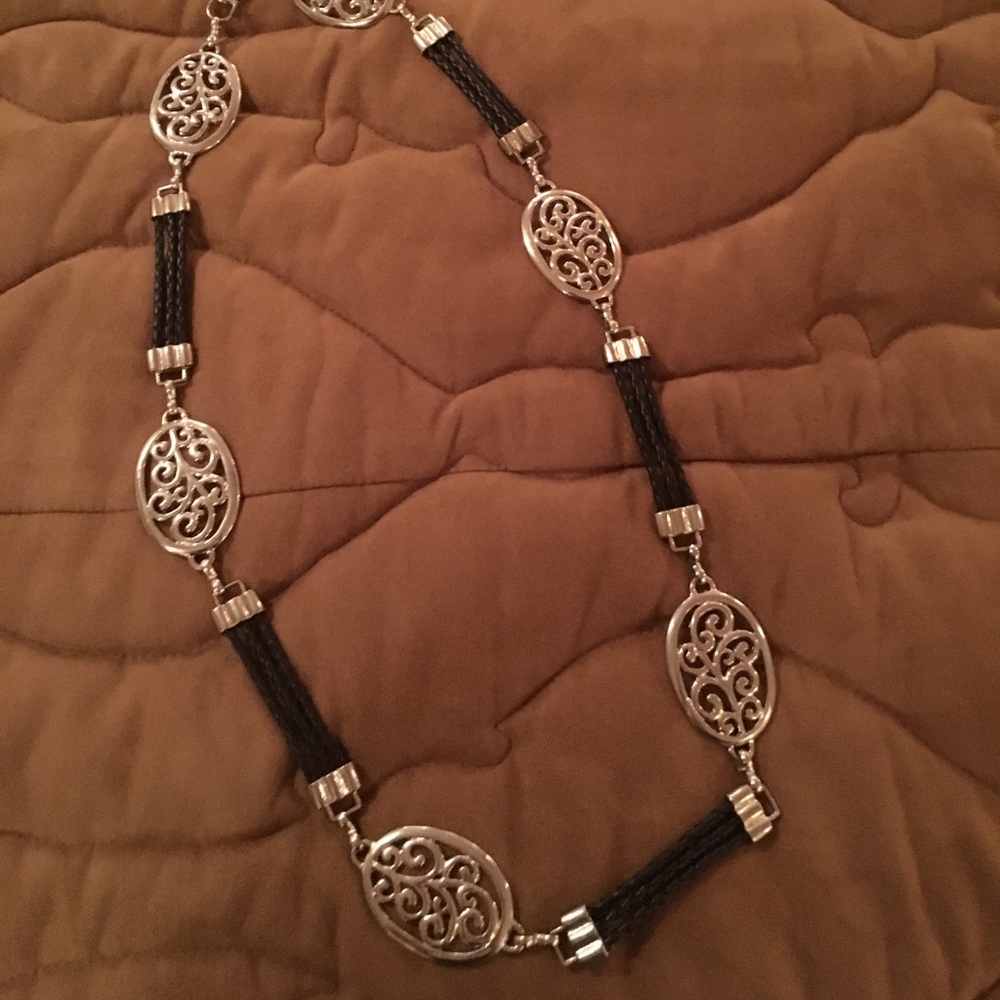 Silver and black leather belt.